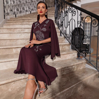 Abito lungo elegante con maniche a pipistrello